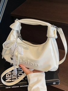 White oil wax leather half-moon handbag with pearl charm and fashion embossing