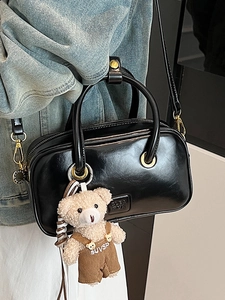 Fashionable black faux leather shoulder bag with cute bear charm for women's daily commute