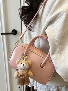 Pale pink patent leather tote bag with cute bear charm for women's daily commute