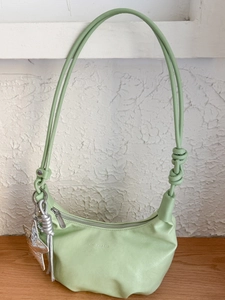 Avocado green pleated dumpling shoulder bag with silver star charm for casual daily use