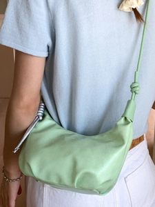 Minimalist light green pleated hobo bag with knotted strap and soft leather finish