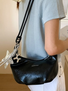 Chic black shiny leather Hobo bag for women with star and balloon dog silver charms