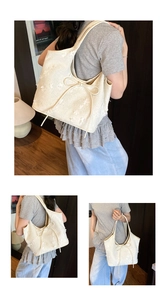 Detail of beige bucket bag featuring 3D floral textures and delicate bow knot accents