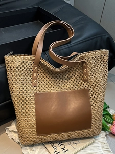 Large capacity woven straw tote bag with brown faux leather handles for beach vacation