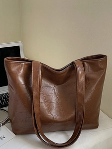 Brown faux crocodile leather tote bag with a high-gloss finish and large capacity for commuting
