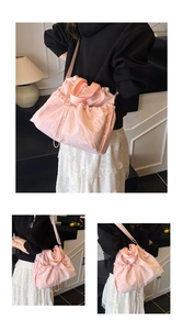 Detail of pink drawstring canvas bucket bag featuring adjustable straps and nylon texture