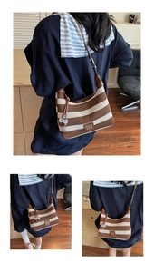 Detail showing knit striped tote texture with CHIC '2ND brand tag and bead charm
