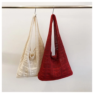 Detailed close-up of handmade woven tote bags with retro checkered crochet patterns