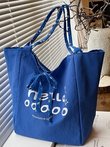 Grand sac cabas en toile bleue avec nœud fleuri et lettrage blanc pour femmes