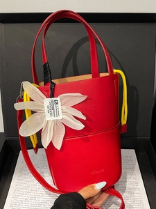 Fashionable red flower bucket bag with yellow drawstring and adjustable strap