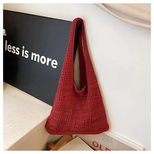 Close-up of deep red crochet tote bag featuring bohemian hollow square knit patterns