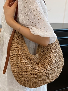 Elegant large capacity woven straw shoulder bag with adjustable brown leather strap