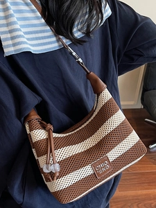 Retro striped knit underarm bag with brown leather strap and brand logo detail