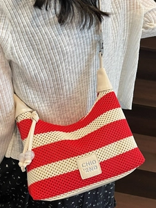 Casual red and white striped knit hobo bag with beige leather strap and brand patch