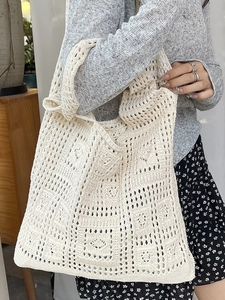 Chic cream white hand-knit hollow tote bag for women with elegant summer beach style