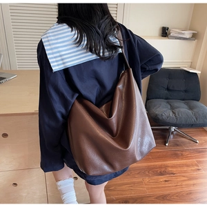 Detail shot of the large vintage brown soft leather tote bag with natural texture