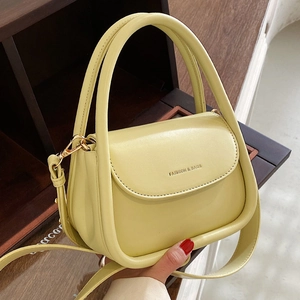 Chic lime yellow mini flap handbag with gold lettering and adjustable crossbody strap