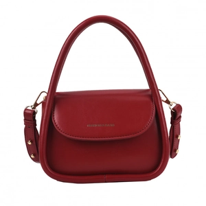 Classic red leather handbag with gold hardware and adjustable strap on a white background