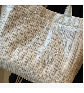 Macro detail of straw woven texture under waterproof PVC layer with TOTE BAG print