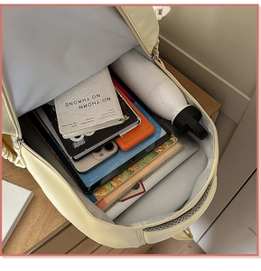 Detailed interior view of a large capacity canvas school backpack with compartments