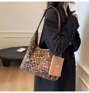 Detail of vintage leopard print hobo bag with matching small coin pouch and shoulder strap