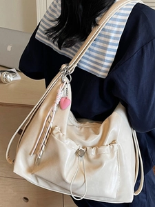 Fashionable cream white oversized PU leather tote bag with drawstring and pink heart charm
