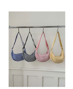 Detail showing four gingham dumpling bags in navy, black, pink and yellow hanging on a rack