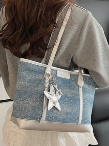 Blue denim tote bag with silver leather trim and glitter star charm for women