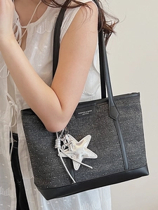 Large grey polka dot canvas tote bag with leather straps and silver star pendant