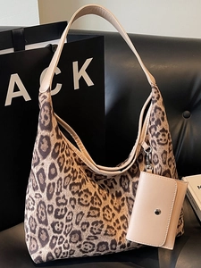 Retro leopard print tote bag with small pouch on a leather sofa, large capacity fashion bag