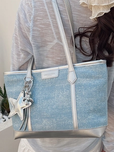 Stylish large light blue denim tote bag with silver studs and star bag charm for women