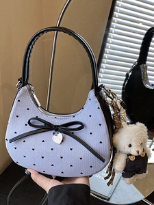 Blue striped crescent bag with a large black bow, heart print, and cute bear pendant