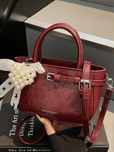 Vintage dark red wrinkled leather handbag with lace bow and pearl heart charm