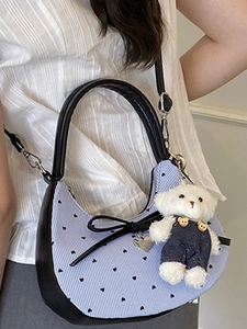 Blue striped crossbody bag with black hearts, bow detail and teddy bear charm for women