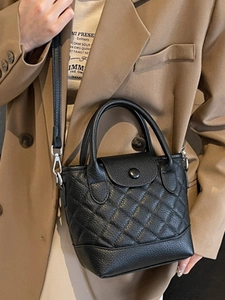 French chic black quilted bucket bag with crossbody strap for elegant women fashion