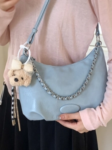 Blue semi-circle hobo shoulder bag with silver chain strap and plush bear charm