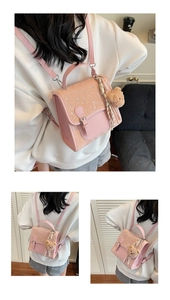 Detail of pink fashion backpack with rhinestone buckle and cute teddy bear plush charm