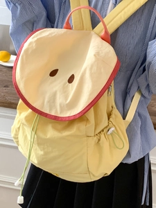 Cute yellow macaron waterproof backpack with embroidery and colorful straps for girls