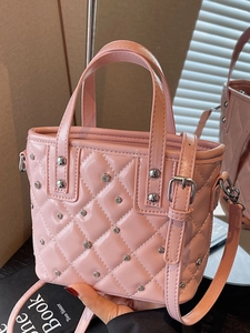 Pink quilted bucket bag with silver studs and polished patent leather for women