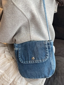 Minimalist blue denim crossbody bag for women with silver button and slim shoulder strap