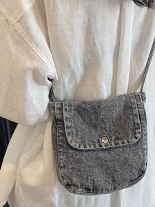 Vintage dark gray denim crossbody bag with contrast stitching and silver buckle detail