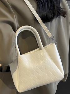 White quilted cross-body bucket bag with silver hardware and top handle for women