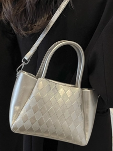 Quilted silver crossbody bucket bag with round handle and detachable shoulder strap for women