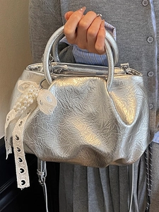 Silver pleated cloud handbag with round handle and pearl lace bow charm for women