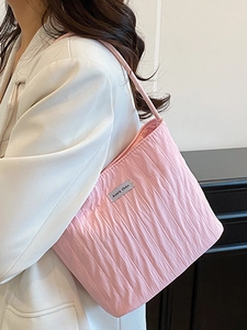 Japanese minimalist pink tote bag with pleated canvas texture and slim shoulder straps