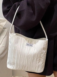 Minimalist white pleated canvas tote bag with Ann's then logo for casual commuting