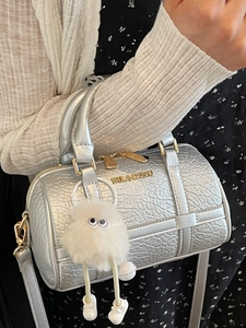 Elegant silver pillow bag with stone texture and cute plush charm for women