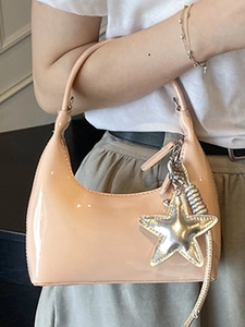 Minimalist light peach patent leather hobo bag with star charm and silver hardware