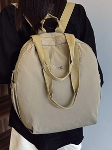 Large khaki puffer backpack for women made of lightweight waterproof nylon for travel