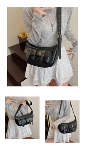 Macro view of black soft leather crossbody tote with functional multi-pockets and buckles